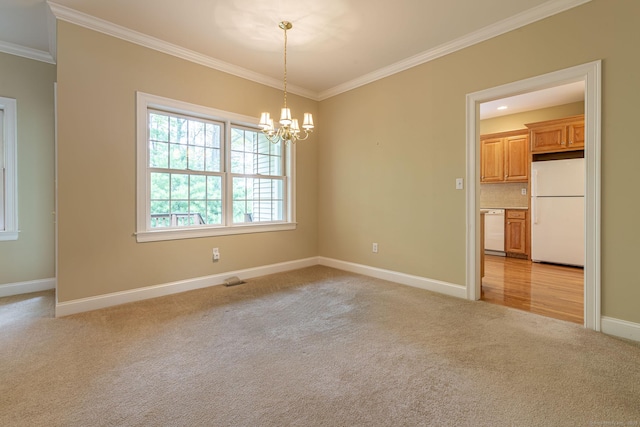 empty room featuring ornamental molding, light carpet, baseboards, and a notable chandelier