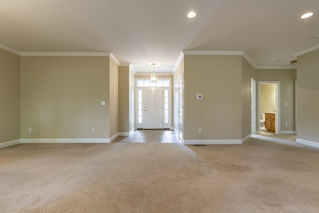 entryway featuring light carpet, baseboards, ornamental molding, and recessed lighting