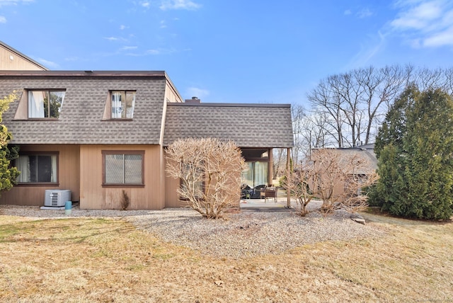 back of property featuring a patio and a yard