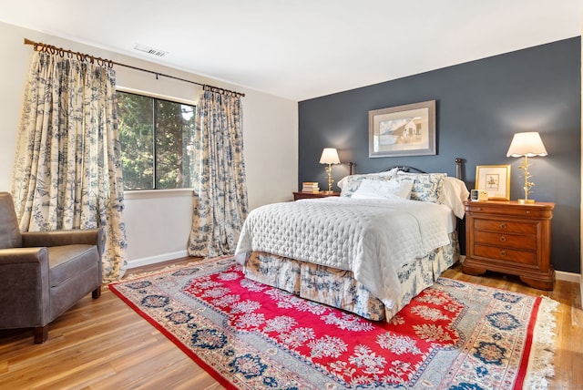 bedroom featuring hardwood / wood-style floors