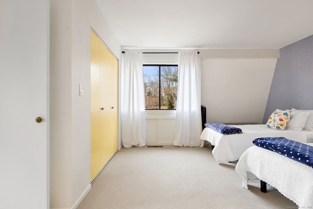 bedroom featuring a closet and carpet flooring