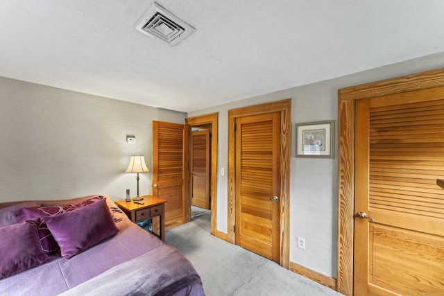 bedroom featuring light colored carpet