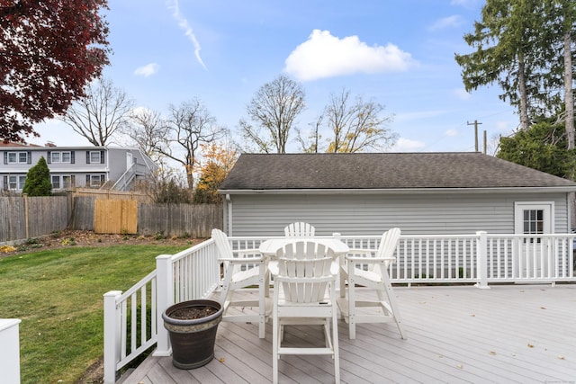 wooden terrace featuring a yard