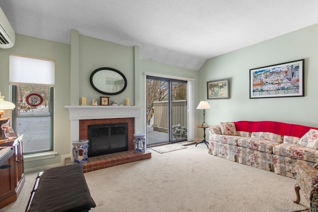 living room featuring lofted ceiling, a fireplace, light colored carpet, and a wall unit AC