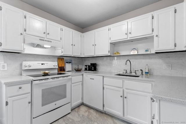 kitchen with tasteful backsplash, white cabinetry, sink, and white appliances