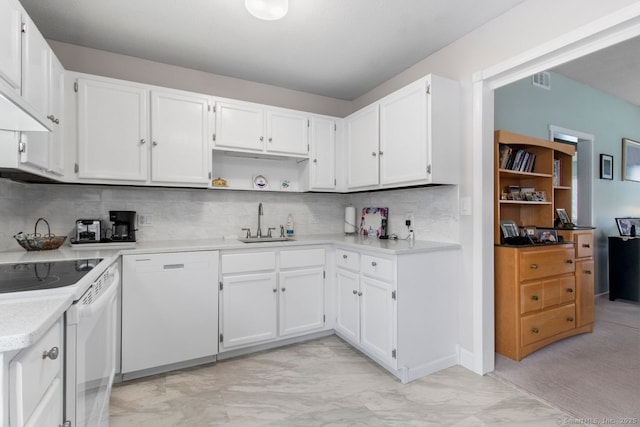 kitchen with white cabinetry, white appliances, sink, and decorative backsplash