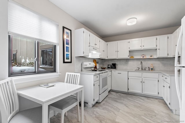 kitchen with white cabinetry, sink, white appliances, and decorative backsplash