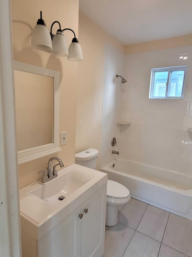 full bathroom with tiled shower / bath combo, toilet, tile patterned flooring, and vanity