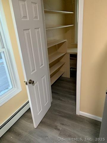 pantry with a baseboard heating unit