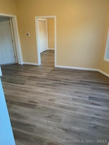 unfurnished room featuring hardwood / wood-style floors