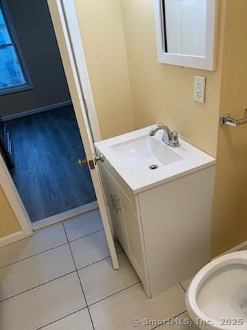 bathroom featuring vanity, toilet, and tile patterned floors