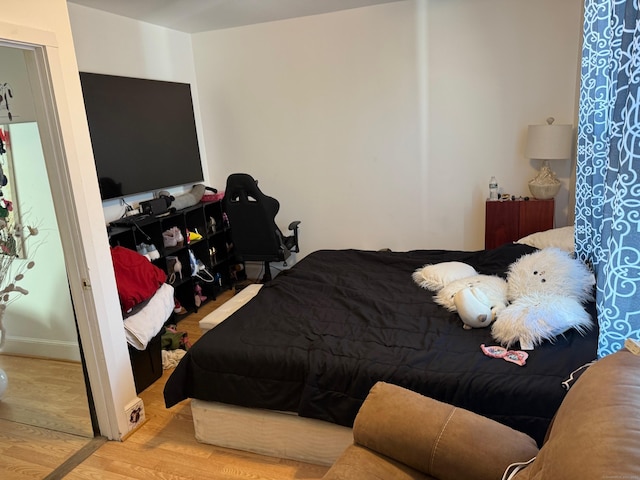 bedroom featuring light wood-type flooring