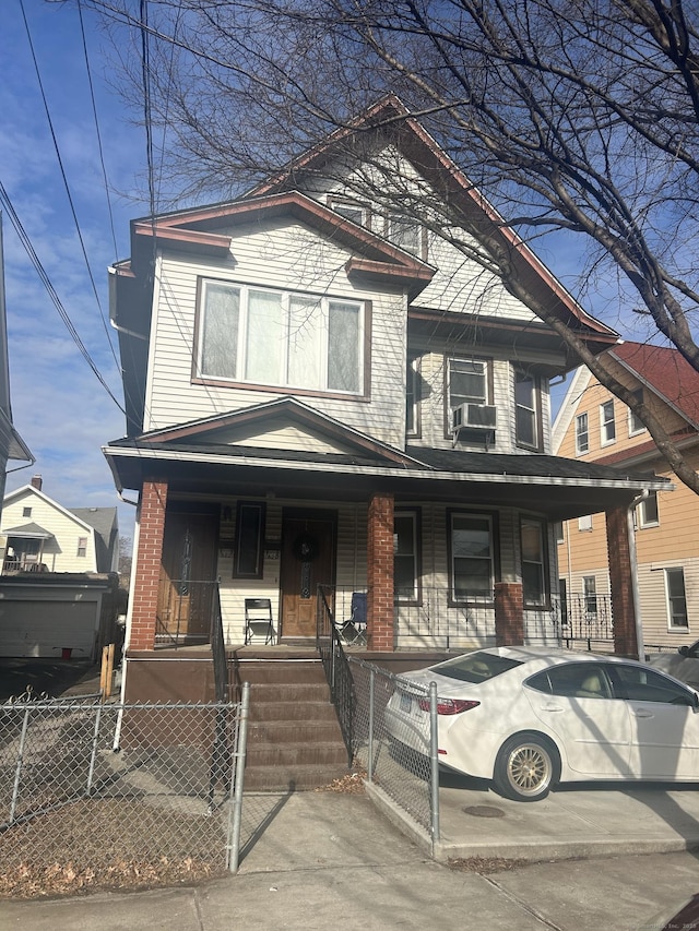 view of front facade with covered porch and cooling unit