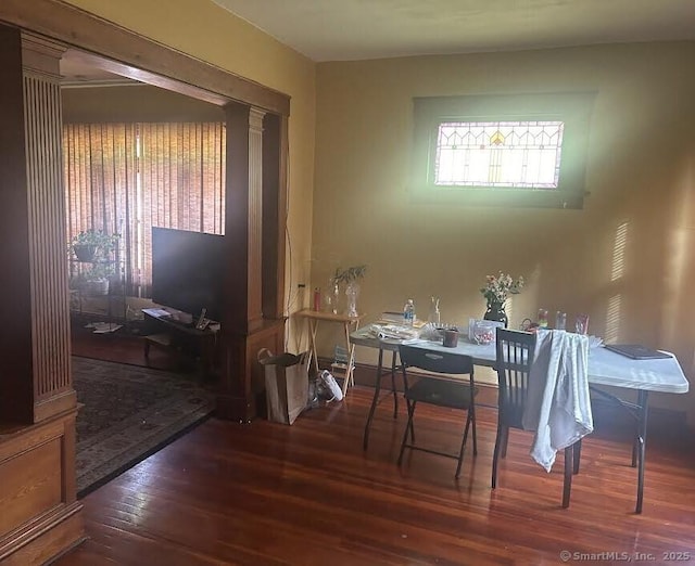 dining space featuring hardwood / wood-style flooring