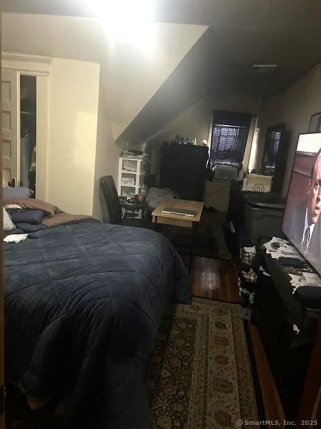 bedroom featuring wood-type flooring