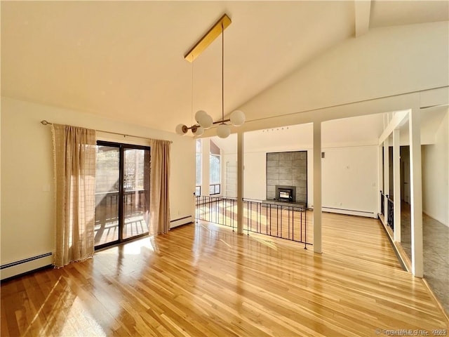 unfurnished living room with beamed ceiling, wood-type flooring, and a baseboard radiator