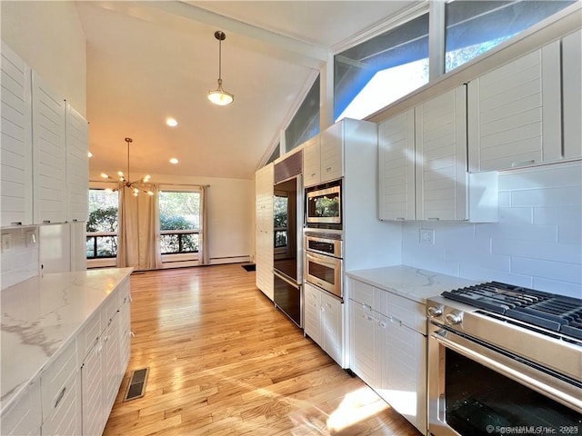 kitchen featuring pendant lighting, white cabinetry, built in appliances, and vaulted ceiling with beams