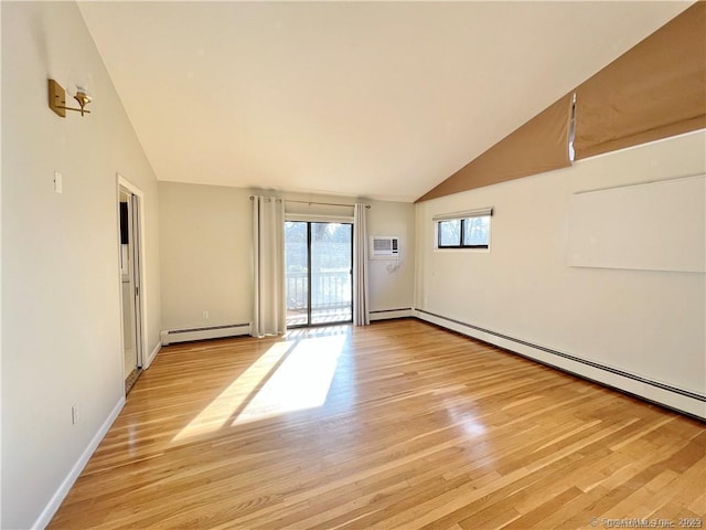 unfurnished room with lofted ceiling, light wood-type flooring, a wall mounted air conditioner, and a baseboard radiator