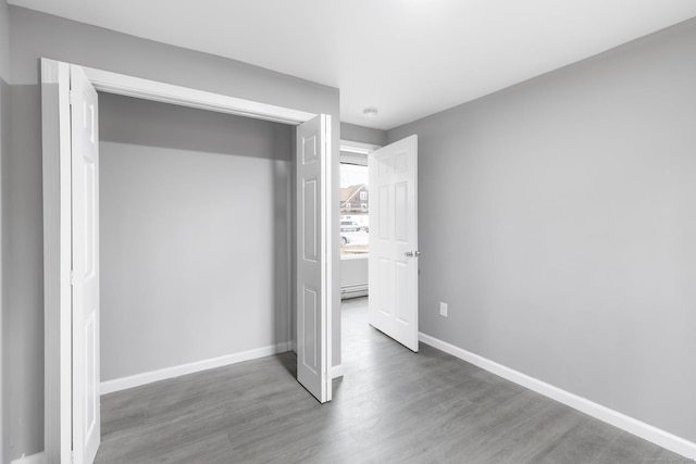 unfurnished bedroom featuring wood-type flooring