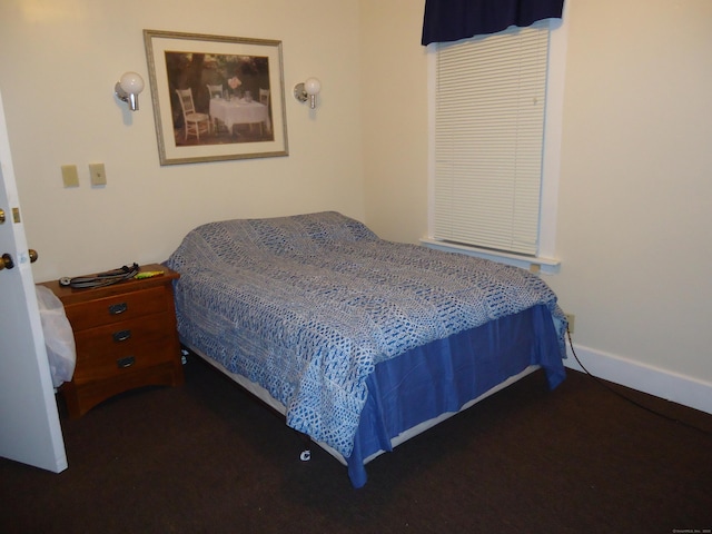 bedroom with dark carpet