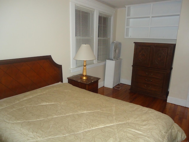 bedroom featuring dark wood-type flooring