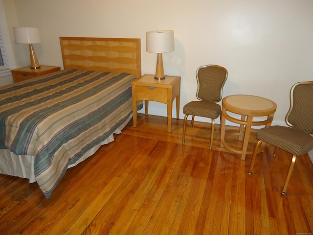 bedroom with hardwood / wood-style flooring