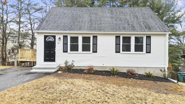 view of front facade with a wooden deck