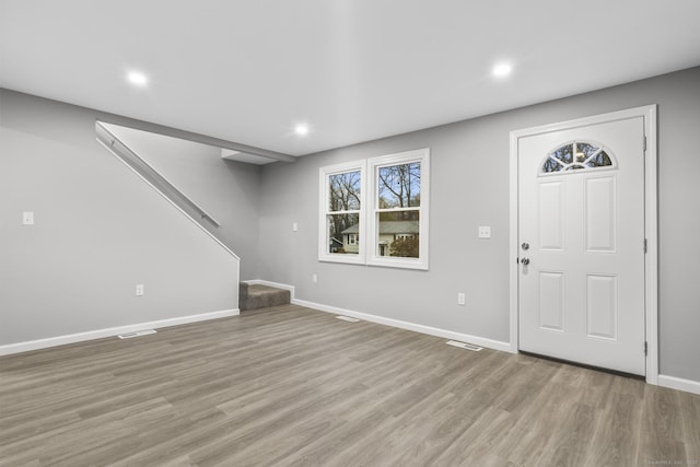 foyer entrance with light hardwood / wood-style flooring