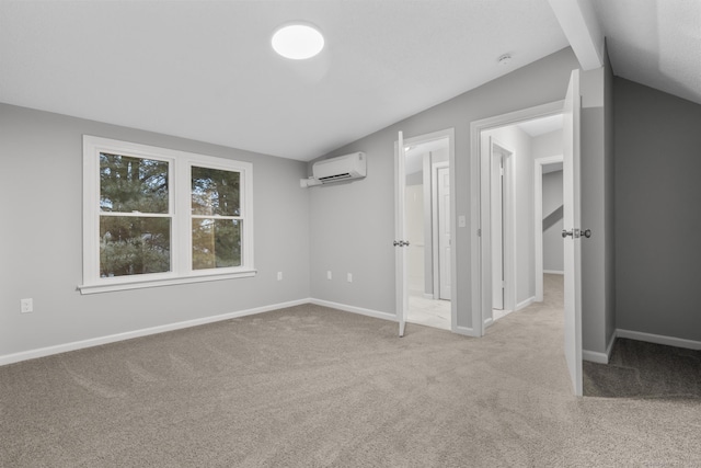 interior space with lofted ceiling and a wall mounted air conditioner