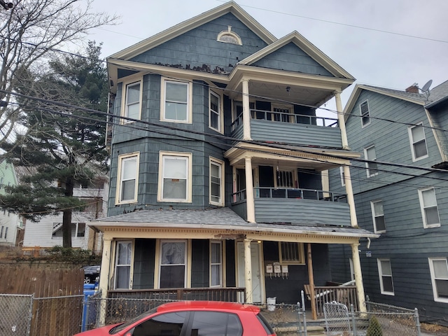 view of front of home with a balcony and a porch