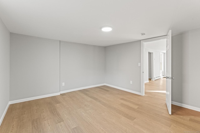 spare room with light hardwood / wood-style floors