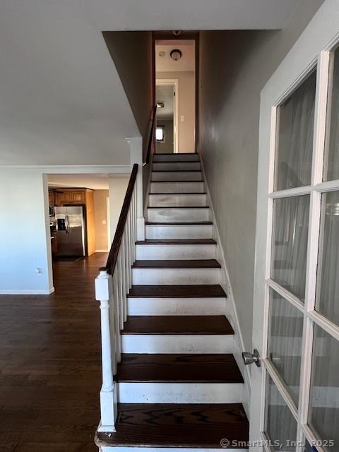 staircase featuring hardwood / wood-style floors