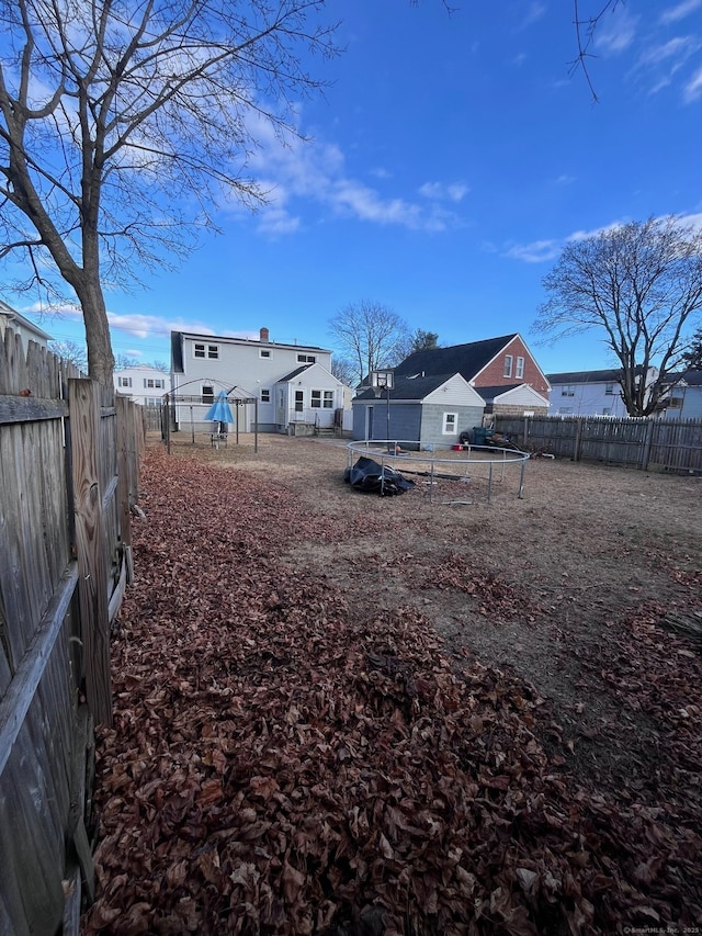 view of yard with a trampoline