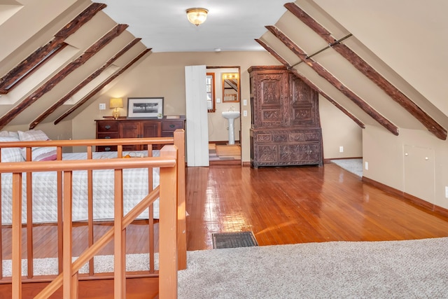 bonus room with lofted ceiling and hardwood / wood-style floors