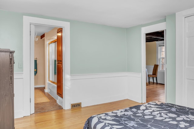 bedroom with wood-type flooring