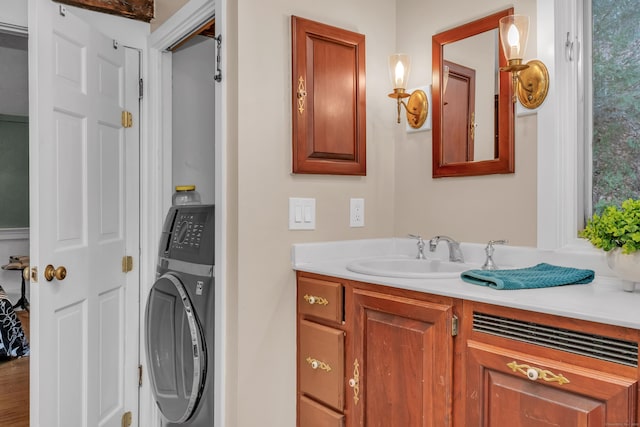 bathroom featuring washer / dryer and vanity