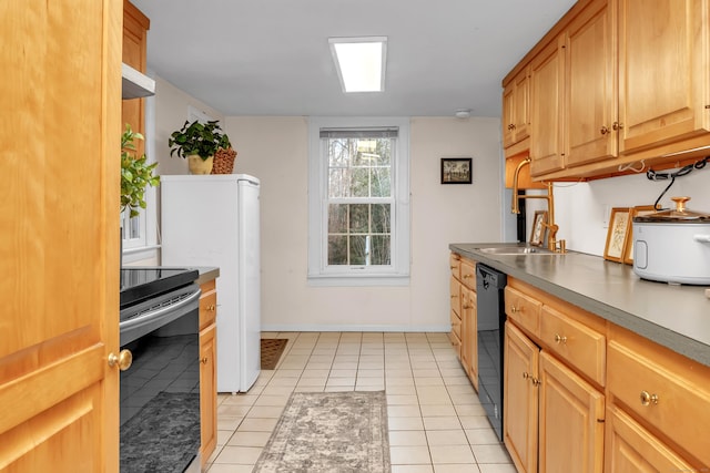 kitchen with stainless steel electric stove, light tile patterned floors, and black dishwasher