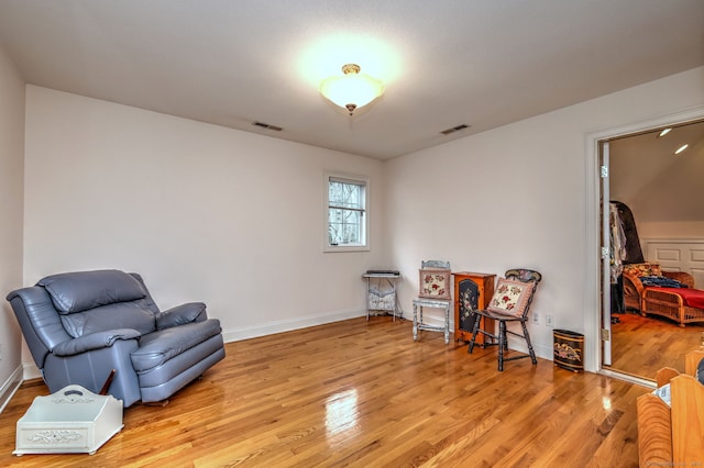 sitting room featuring light hardwood / wood-style floors