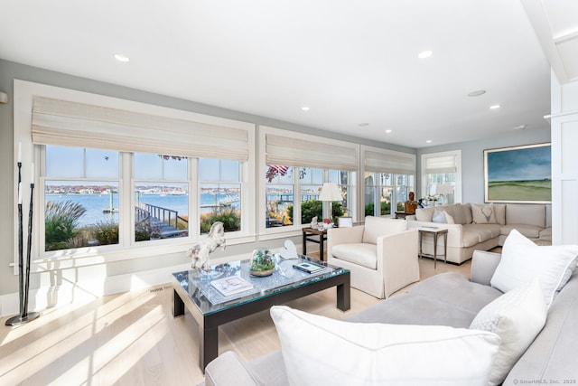 living room featuring recessed lighting, visible vents, and wood finished floors