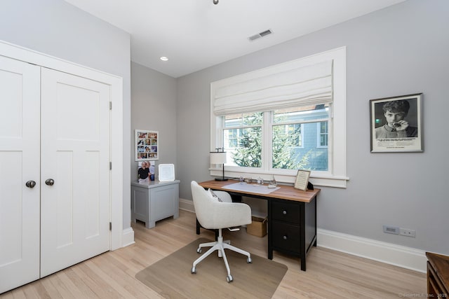 office area with light wood-style flooring, recessed lighting, baseboards, and visible vents