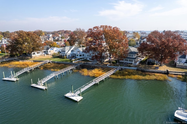 view of dock featuring a water view and a residential view