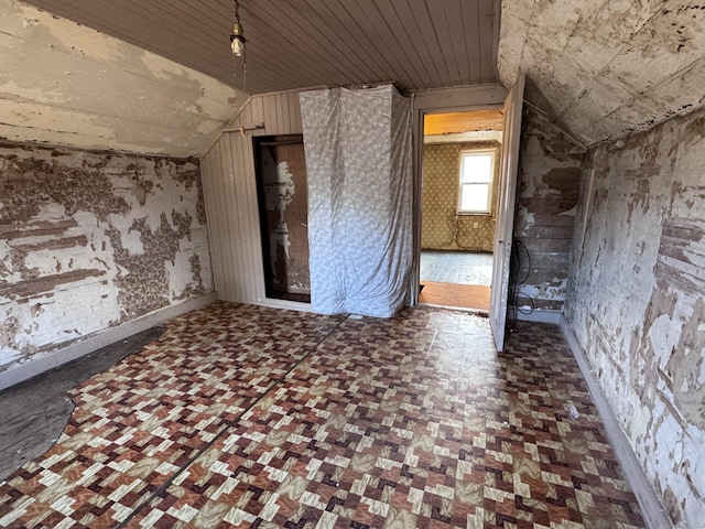 unfurnished room with wood ceiling and lofted ceiling