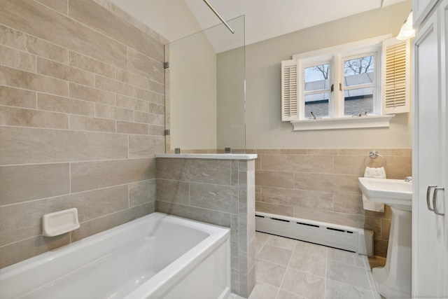 full bathroom featuring a walk in shower, a baseboard heating unit, tile walls, a bath, and tile patterned floors