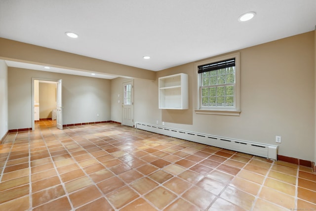 unfurnished room featuring light tile patterned floors, a baseboard heating unit, and recessed lighting