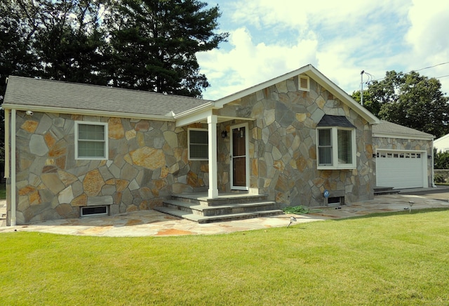 view of front of home with a garage and a front yard