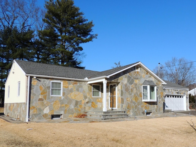 view of front facade with a garage and a front lawn