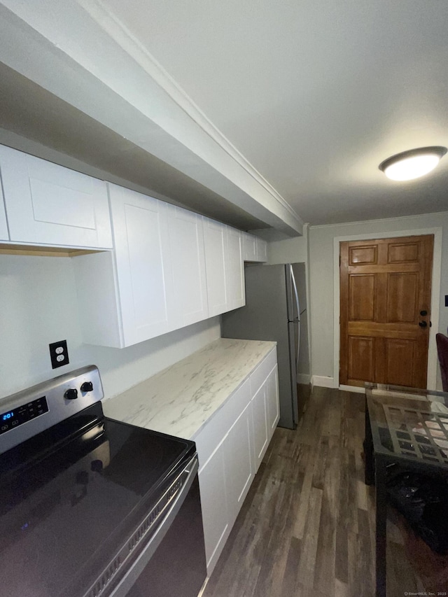 kitchen with dark wood-type flooring, white cabinetry, and stainless steel appliances