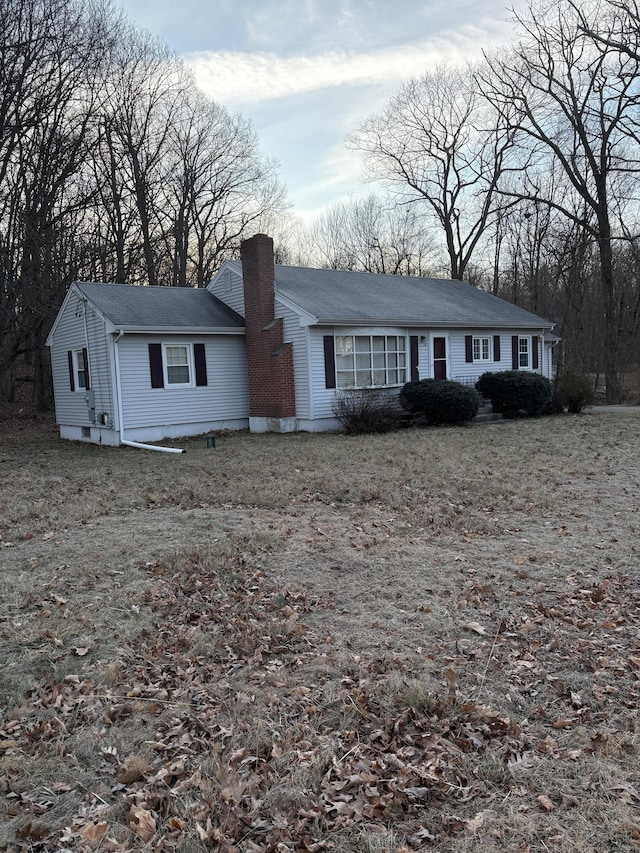 view of front of home featuring a chimney