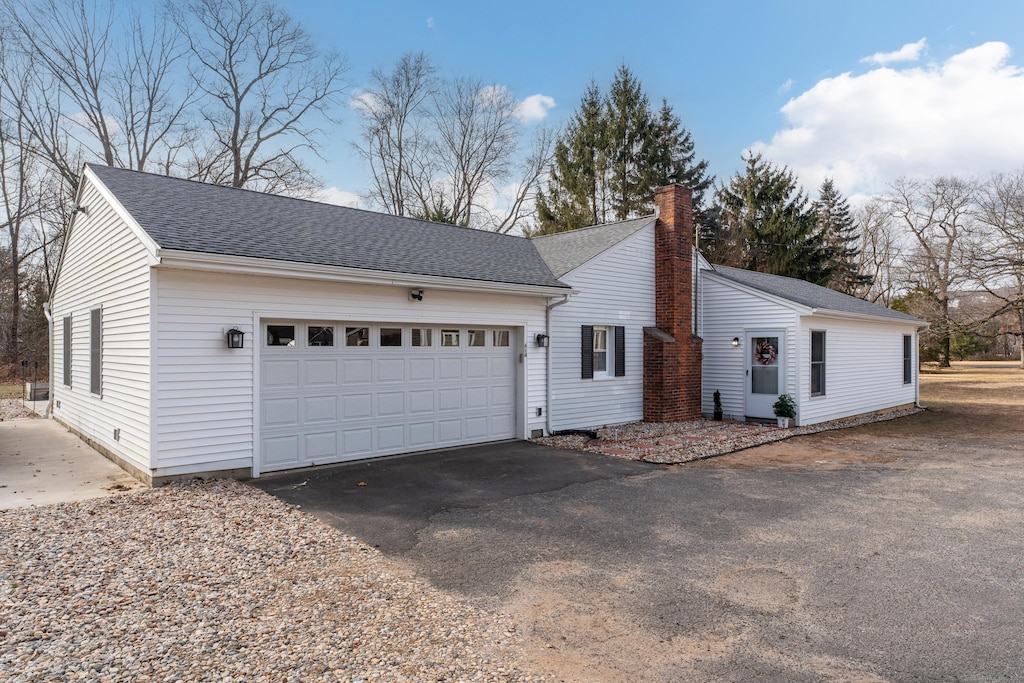 view of side of home featuring a garage