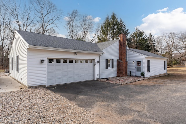 view of side of property with a garage